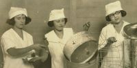 women with canning equipment