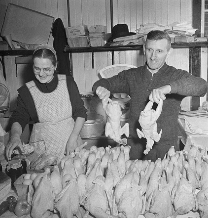Mennonite farmer and wife selling fowl at the farmer's market.jpg