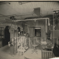Front view of respiration calorimeter. Air pump, water meter, observers table and entrance to the respiration chamber are shown in detail. The large balance at the left of the picture is used for weighing the caron-dioxid and water absorbers and the oxygen cylinder.  Judd Hall, Wesleyan University, Middletown, Connecticut