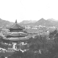 A panoramic view from [P. H.] Dorsett&#039;s window in his headquarters at the Chosen Hotel. In the foreground is the Temple of Heaven, beyond, a portion of the city and the mountains in the background. [Kujo?], Chosen. Photograph #44410.