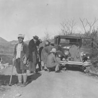 Repairing a blowout on Mr. Stensham&#039;s car. Photograph #43372.