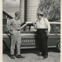 Charlie Slate, Farm Service Director of the Carolina Radio Network, interviews a local farmer in the spring of 1962.