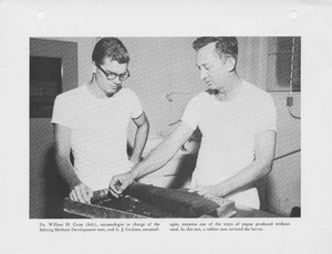 Thumbnail for the first (or only) page of Photograph &quot;Dr. William H. Cross (left), Entomologist in Charge of the Sebring Methods Development Unit, and A. J. Graham, Entomologist, Examine One of the Trays of Pupae Produced Without Sand.