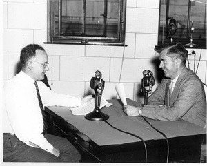 Thumbnail for the first (or only) page of Henry A. Wallace, Secretary of Agriculture (right) and Morse Salisbury, USDA broadcaster, doing a program for the National Farm and Home Hour, circa 1939..