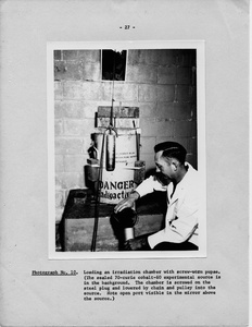 Thumbnail for the first (or only) page of Photograph &quot;Loading an Irradiation Chamber with Screw-Worm Pupae&quot;.
