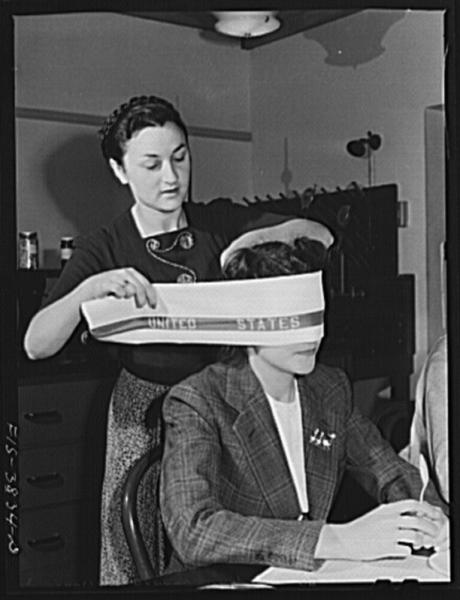 Blindfolding a tester of cooked dehydrated spinach at the regional agricultural research laboratory. Albany, California